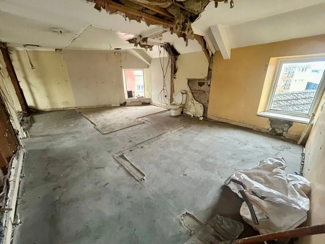 Opportunity to acquire this three storey end of terrace property in Neath. Three retail units to the ground floor with residential redevelopment opportunity to upper floors and a large rear car park.