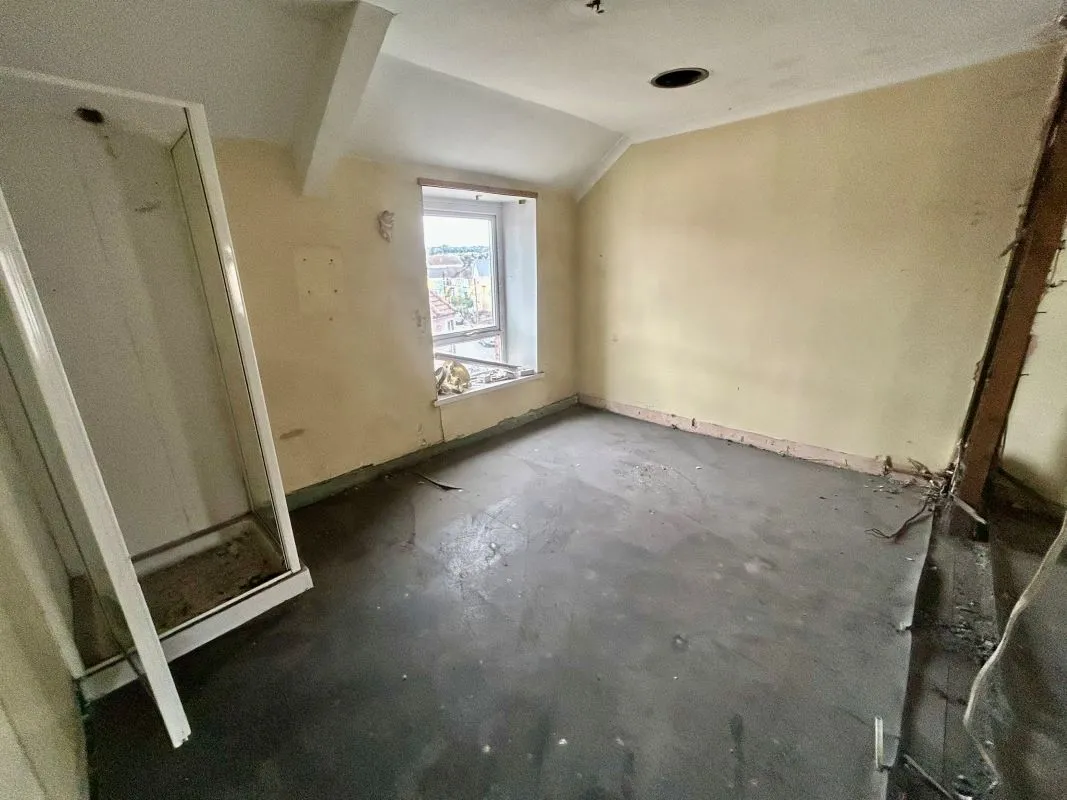 Opportunity to acquire this three storey end of terrace property in Neath. Three retail units to the ground floor with residential redevelopment opportunity to upper floors and a large rear car park.