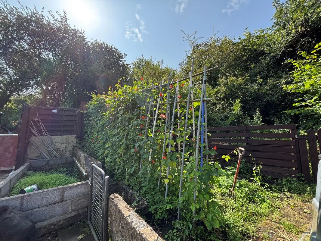 A traditional three-bedroom semi-detached house situated in the established residential area of Garden Suburbs in Trimsaran, offering scope for modernisation and improvement.