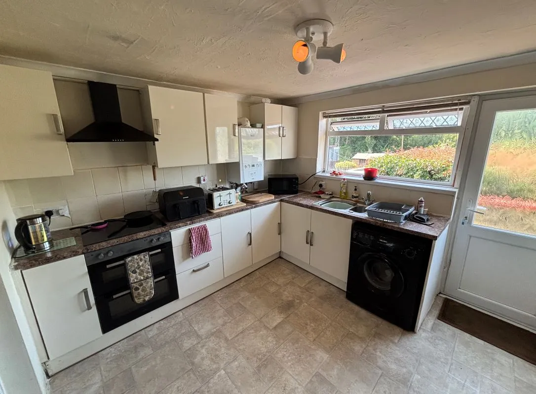 A traditional three-bedroom semi-detached house situated in the established residential area of Garden Suburbs in Trimsaran, offering scope for modernisation and improvement.
