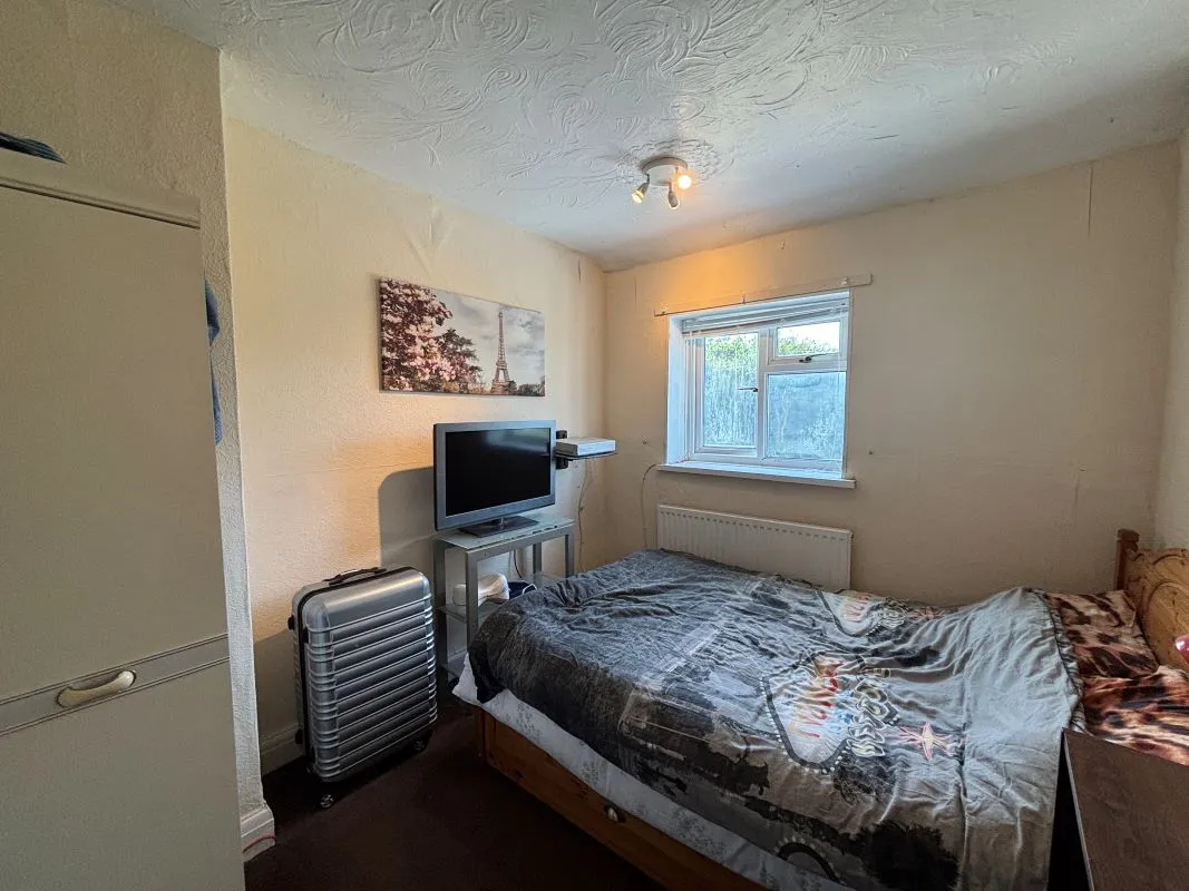 A traditional three-bedroom semi-detached house situated in the established residential area of Garden Suburbs in Trimsaran, offering scope for modernisation and improvement.