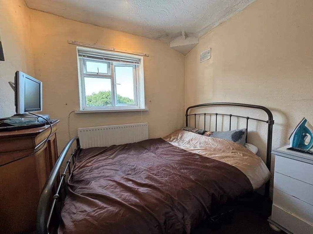 A traditional three-bedroom semi-detached house situated in the established residential area of Garden Suburbs in Trimsaran, offering scope for modernisation and improvement.