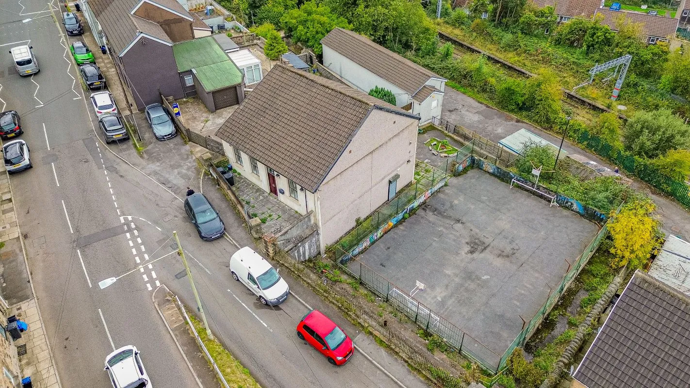 Converted chapel and further large outbuilding currently operated as a 14-16 bed short-term let/hostel with shared rooms and four bathrooms. Potential for development, subject to consents.