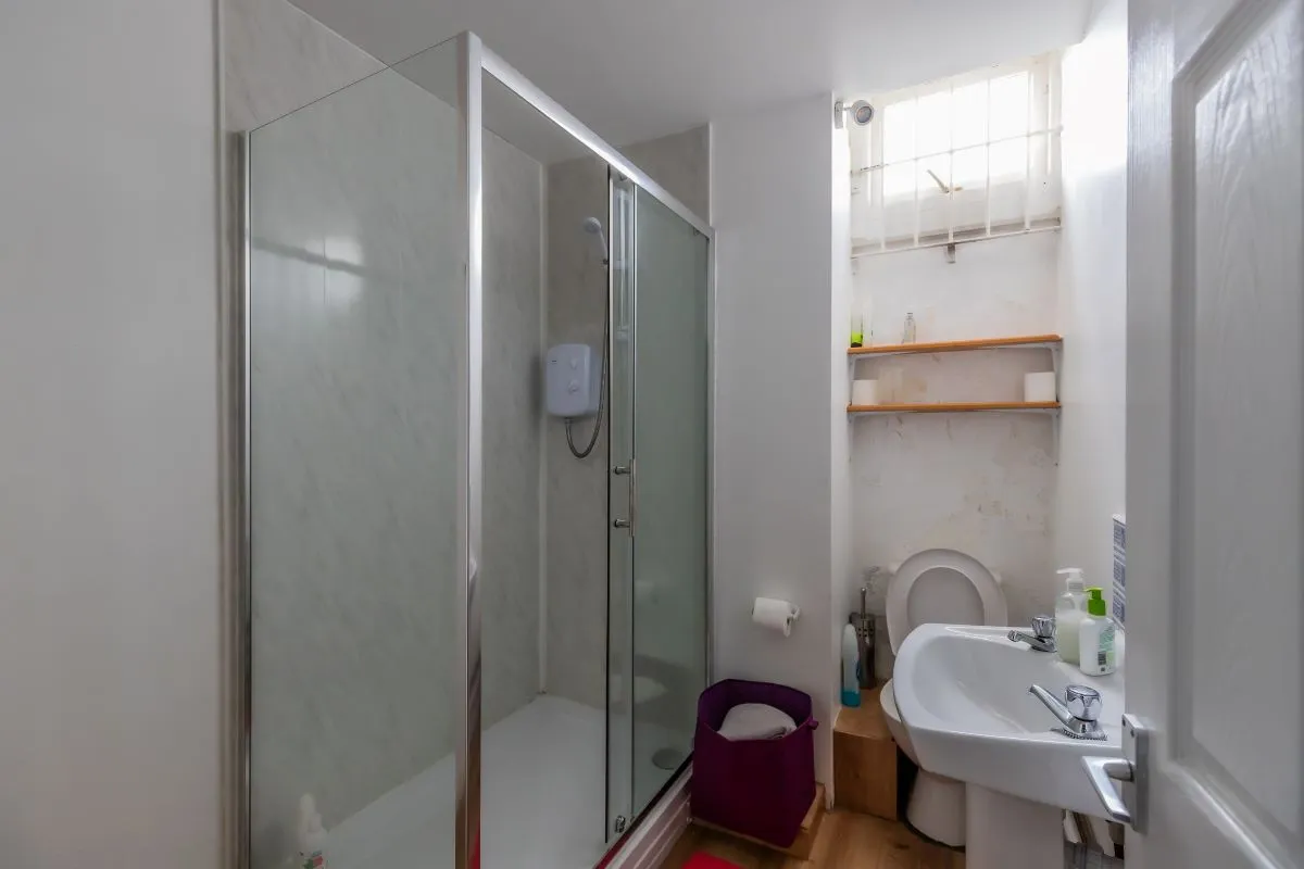 Converted chapel and further large outbuilding currently operated as a 14-16 bed short-term let/hostel with shared rooms and four bathrooms. Potential for development, subject to consents.