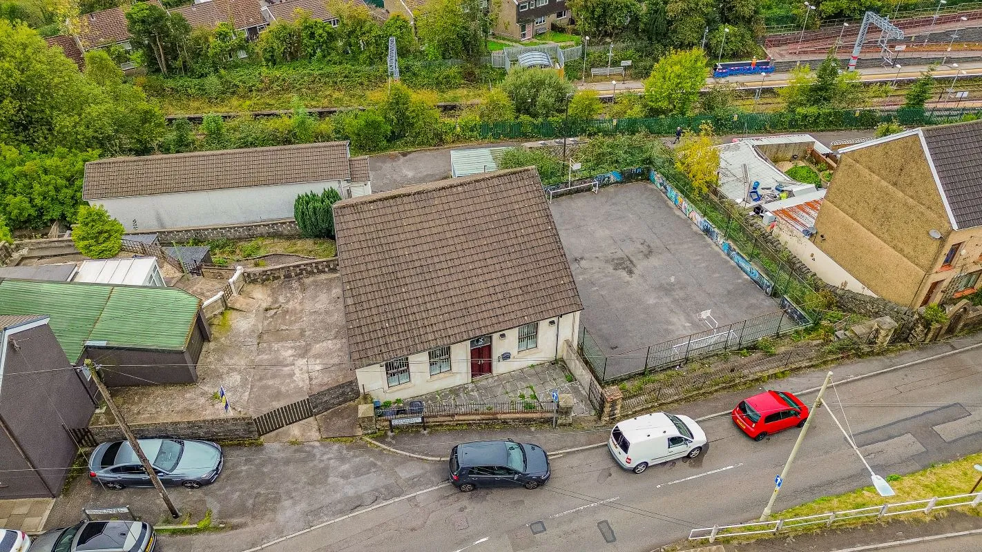 Converted chapel and further large outbuilding currently operated as a 14-16 bed short-term let/hostel with shared rooms and four bathrooms. Potential for development, subject to consents.
