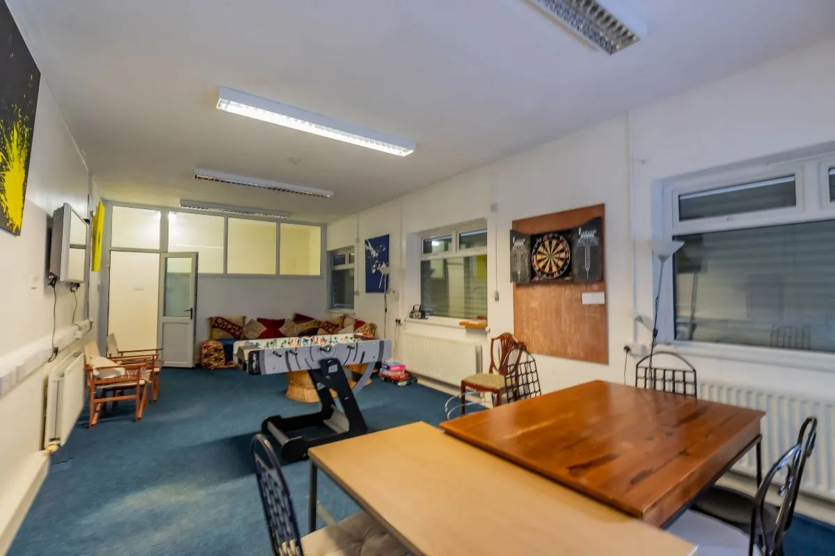 Converted chapel and further large outbuilding currently operated as a 14-16 bed short-term let/hostel with shared rooms and four bathrooms. Potential for development, subject to consents.