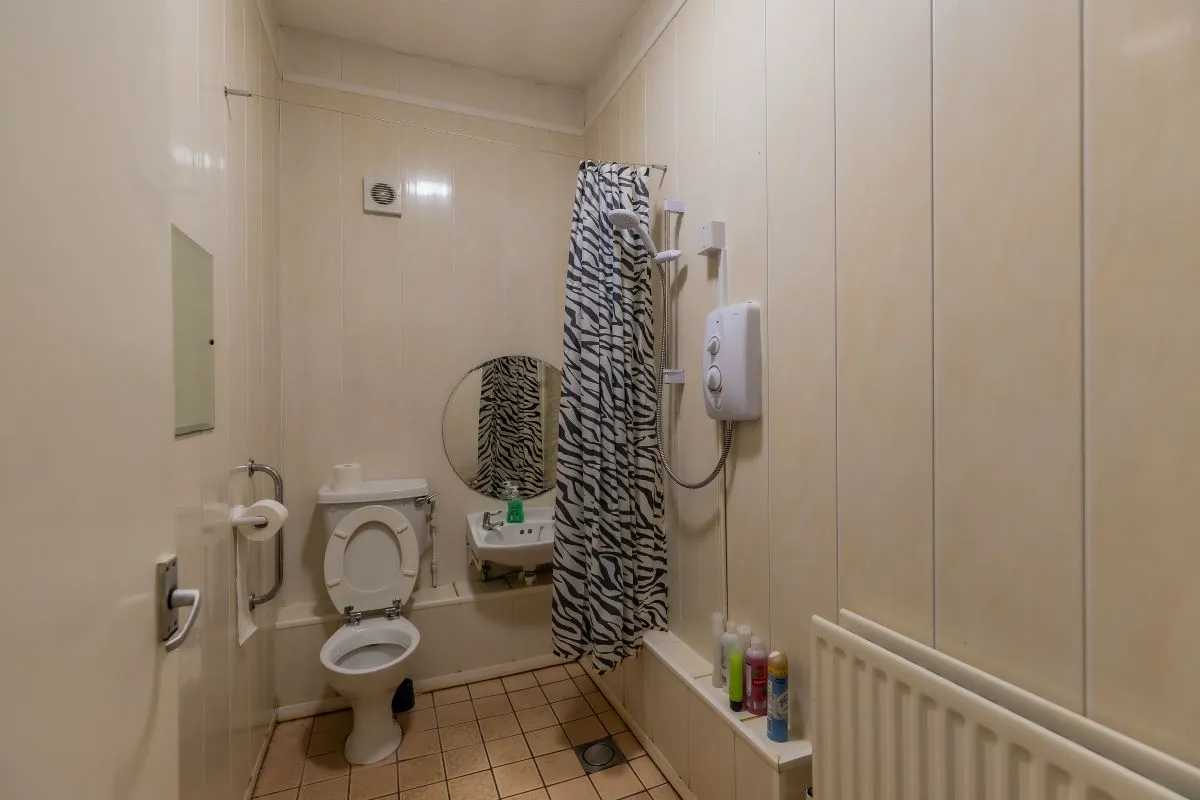 Converted chapel and further large outbuilding currently operated as a 14-16 bed short-term let/hostel with shared rooms and four bathrooms. Potential for development, subject to consents.