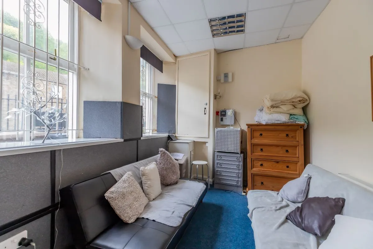 Converted chapel and further large outbuilding currently operated as a 14-16 bed short-term let/hostel with shared rooms and four bathrooms. Potential for development, subject to consents.