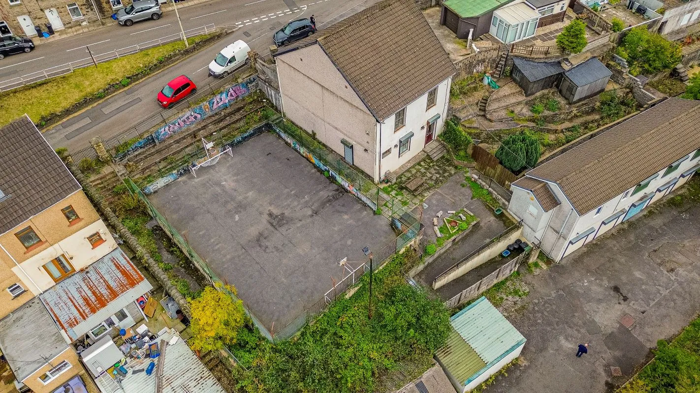 Converted chapel and further large outbuilding currently operated as a 14-16 bed short-term let/hostel with shared rooms and four bathrooms. Potential for development, subject to consents.