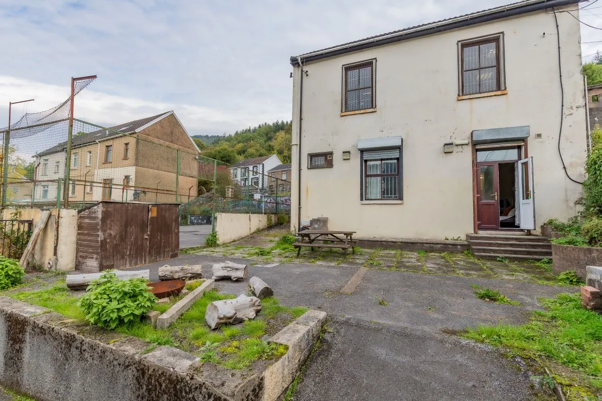 Converted chapel and further large outbuilding currently operated as a 14-16 bed short-term let/hostel with shared rooms and four bathrooms. Potential for development, subject to consents.
