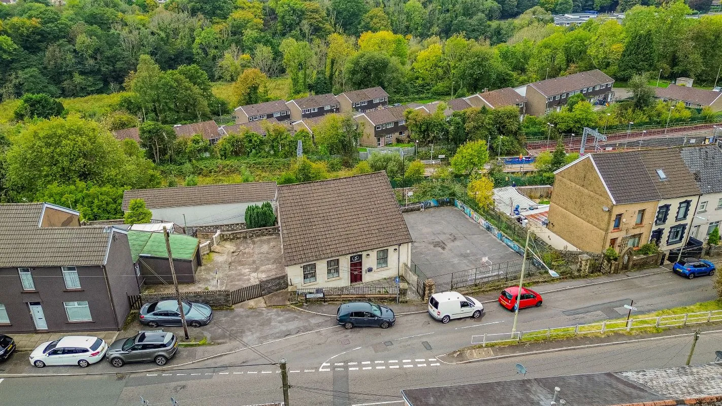 Converted chapel and further large outbuilding currently operated as a 14-16 bed short-term let/hostel with shared rooms and four bathrooms. Potential for development, subject to consents.