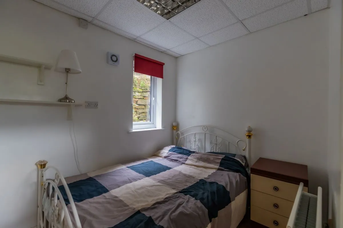 Converted chapel and further large outbuilding currently operated as a 14-16 bed short-term let/hostel with shared rooms and four bathrooms. Potential for development, subject to consents.
