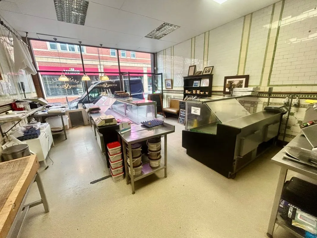 Extensive four storey property in the heart of Barry's retail centre with attractive shop front and huge potential for the upper floors, subject to any necessary consents. Leasehold.