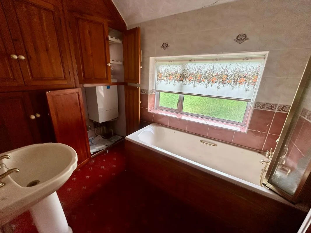 A substantial, four bedroom home in a generous plot with a driveway and double garage. Located on the edge of this popular village close to Abergavenny. In need of repair and improvement throughout.