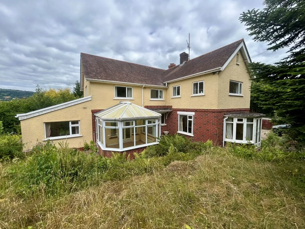 A substantial, four bedroom home in a generous plot with a driveway and double garage. Located on the edge of this popular village close to Abergavenny. In need of repair and improvement throughout.
