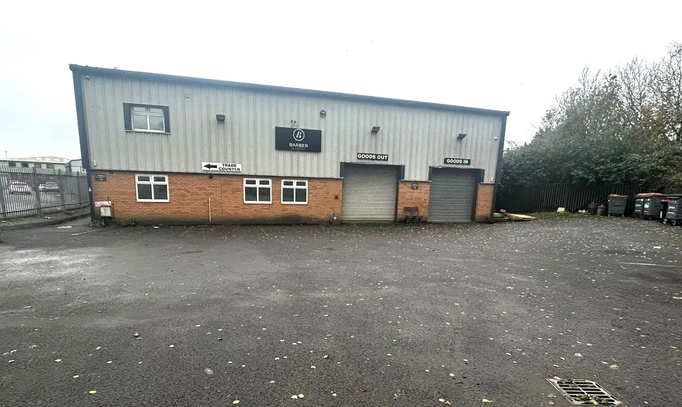 Freehold commercial industrial unit approximately 4490 sq ft occupying a generous plot and 17 parking spaces in Cardiff. Sold with vacant possession.
