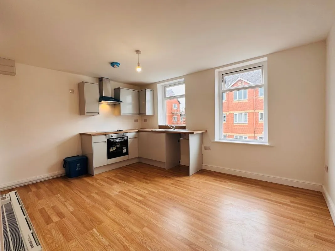 Investment opportunity to purchase a recently renovated split leveled duplex two bedroom flat located on Broadway and within short distance to the city centre.