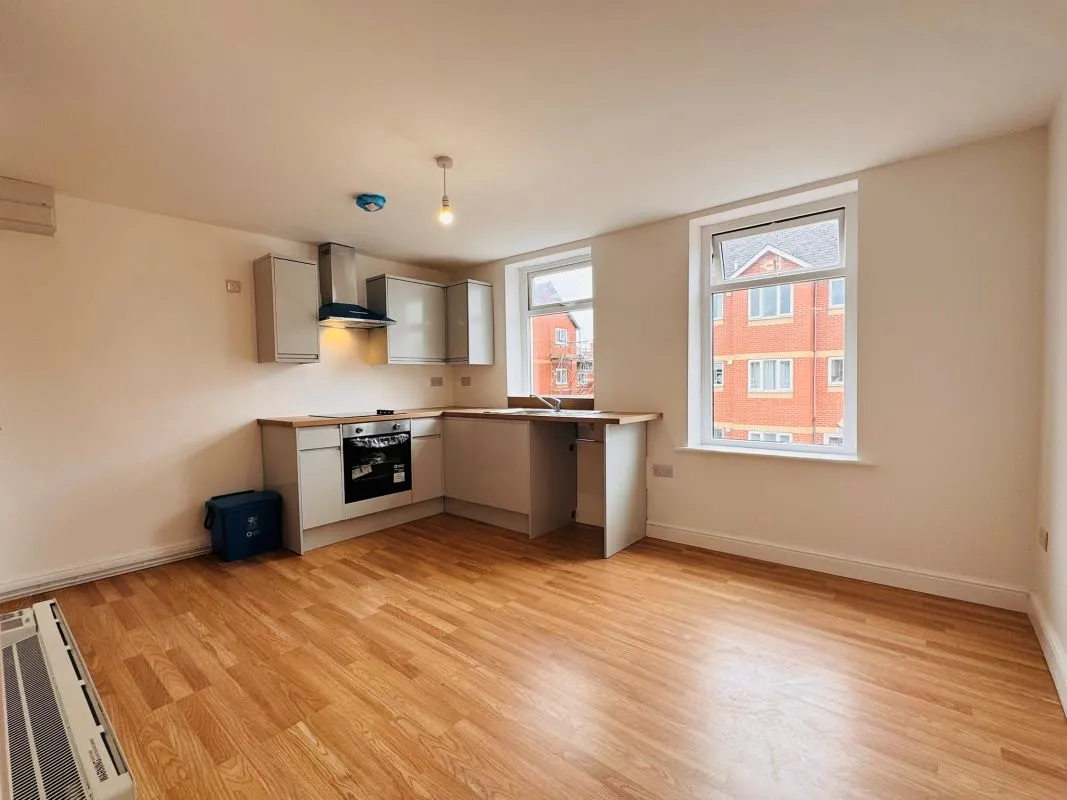 Investment opportunity to purchase a recently renovated split leveled duplex two bedroom flat located on Broadway and within short distance to the city centre.
