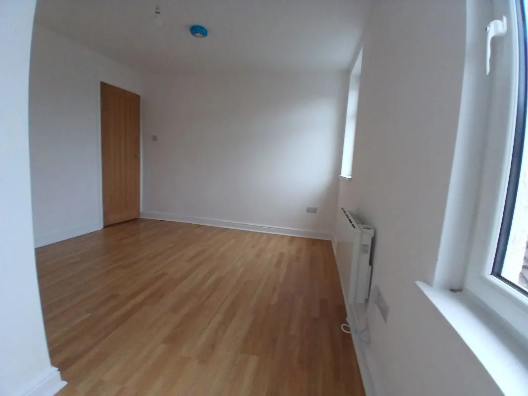 Investment opportunity to purchase a recently renovated split leveled duplex two bedroom flat located on Broadway and within short distance to the city centre.