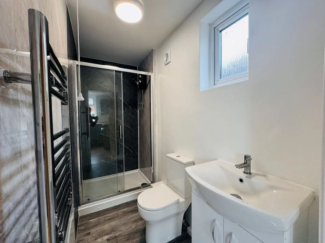 Investment opportunity to purchase a recently renovated split leveled duplex two bedroom flat located on Broadway and within short distance to the city centre.