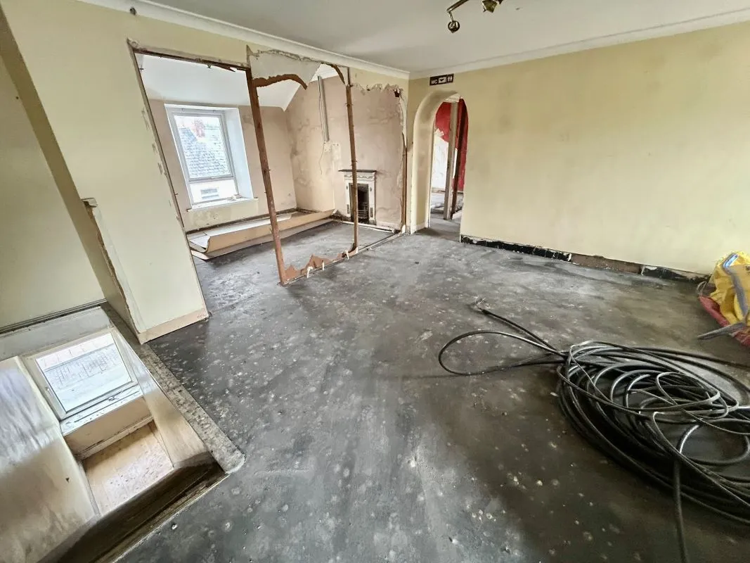 Opportunity to acquire this three storey end of terrace property in Neath. Two commercial units to the ground floor plus a barbers shop with residential redevelopment opportunity to upper floors and a large rear car park with a part-outbuilding also included.