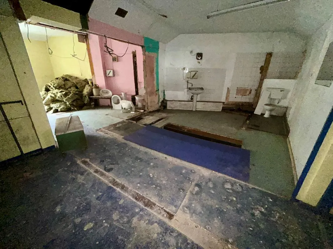 Opportunity to acquire this three storey end of terrace property in Neath. Two commercial units to the ground floor plus a barbers shop with residential redevelopment opportunity to upper floors and a large rear car park with a part-outbuilding also included.