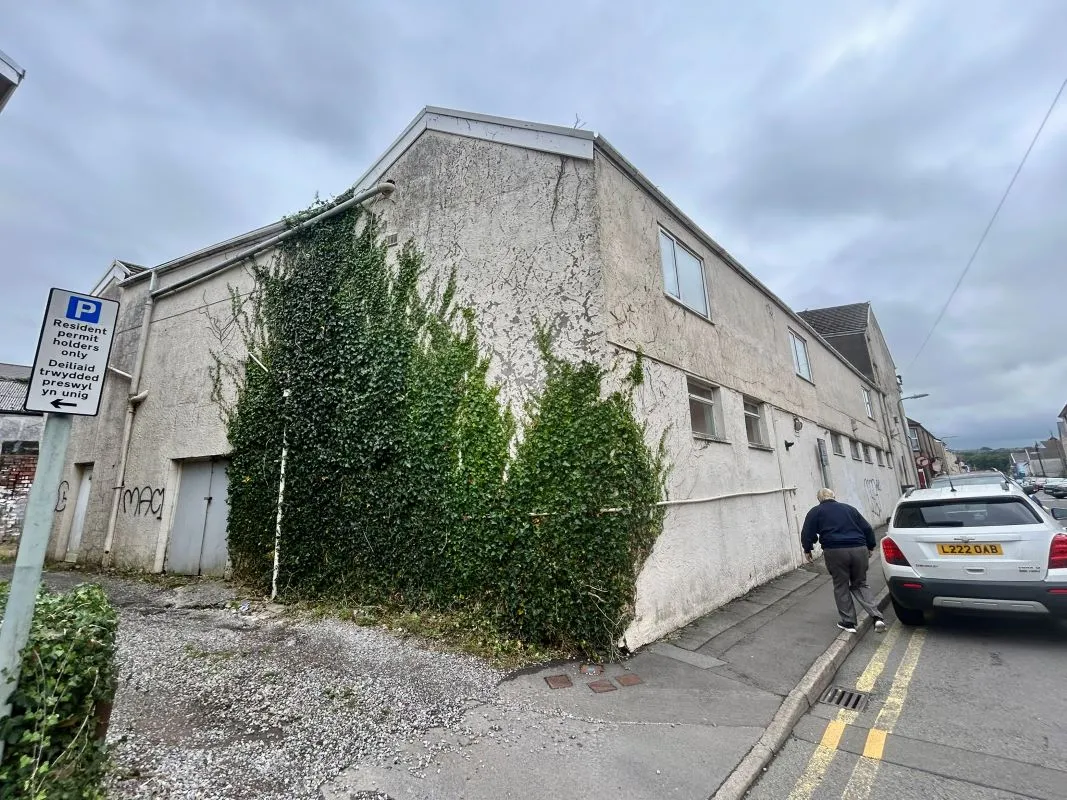 Opportunity to acquire this three storey end of terrace property in Neath. Two commercial units to the ground floor plus a barbers shop with residential redevelopment opportunity to upper floors and a large rear car park with a part-outbuilding also included.