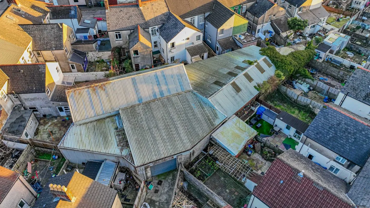 Large warehouse/workshop extending to approximately 5400 sq ft (502 sqm) which could be suitable for a wide variety of uses or complete redevelopment, subject to any necessary consents.