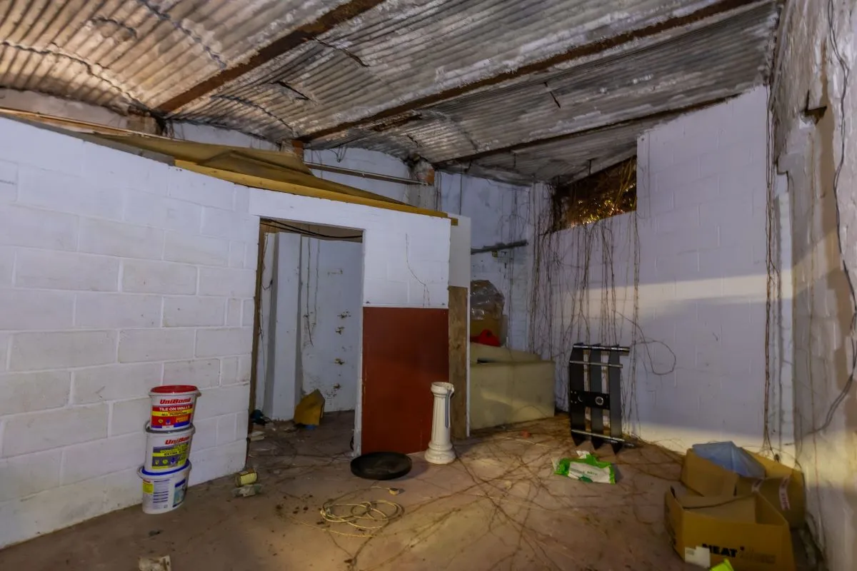 Large warehouse/workshop extending to approximately 5400 sq ft (502 sqm) which could be suitable for a wide variety of uses or complete redevelopment, subject to any necessary consents.