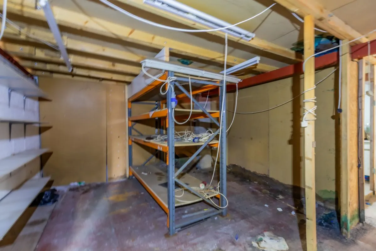 Large warehouse/workshop extending to approximately 5400 sq ft (502 sqm) which could be suitable for a wide variety of uses or complete redevelopment, subject to any necessary consents.