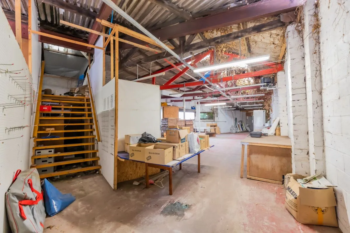 Large warehouse/workshop extending to approximately 5400 sq ft (502 sqm) which could be suitable for a wide variety of uses or complete redevelopment, subject to any necessary consents.