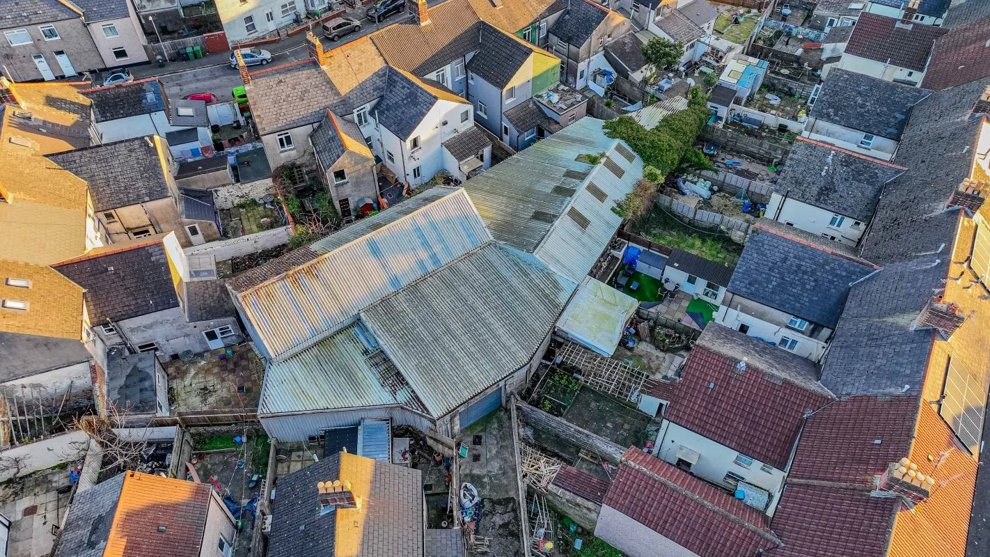 Large warehouse/workshop extending to approximately 5400 sq ft (502 sqm) which could be suitable for a wide variety of uses or complete redevelopment, subject to any necessary consents.