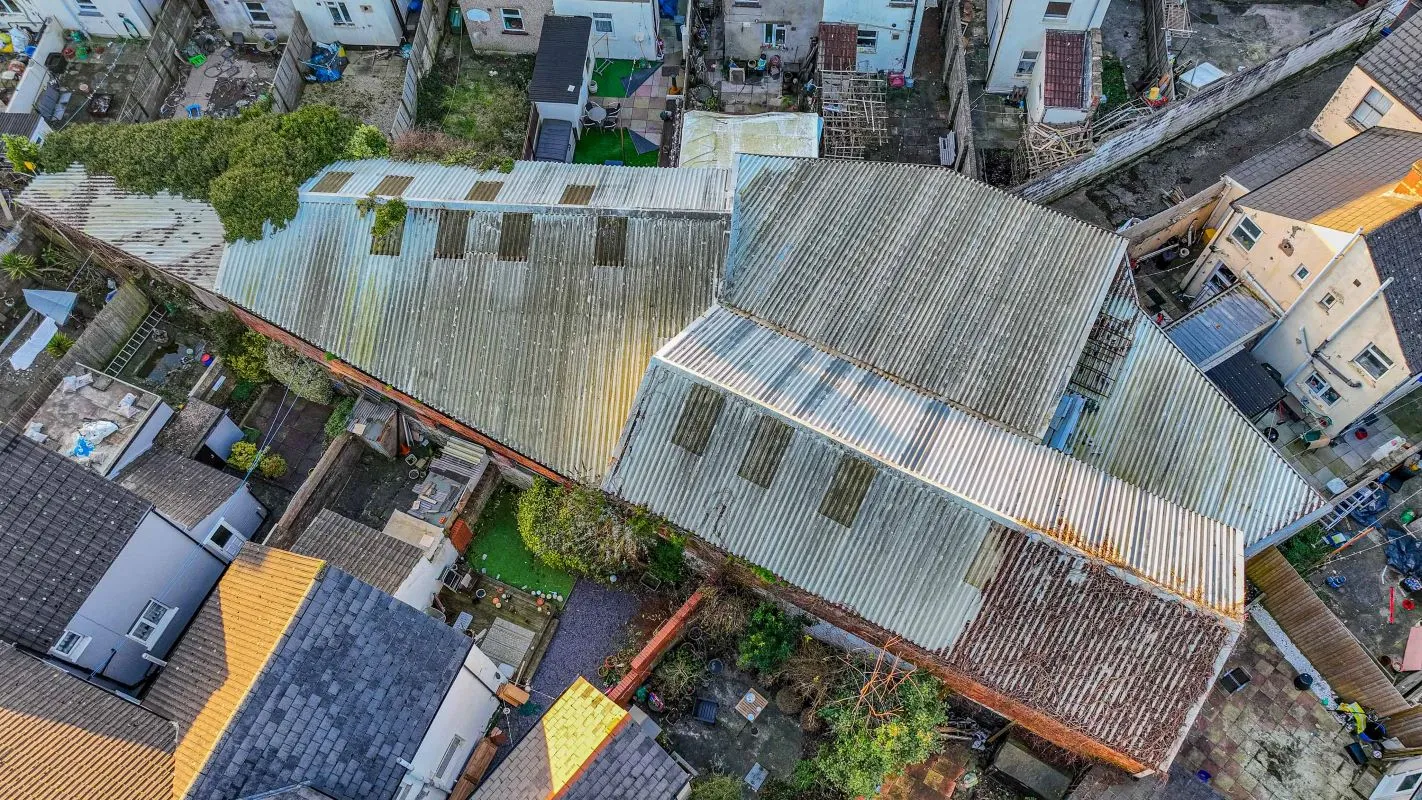 Large warehouse/workshop extending to approximately 5400 sq ft (502 sqm) which could be suitable for a wide variety of uses or complete redevelopment, subject to any necessary consents.