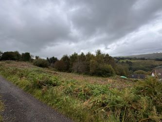 REDUCED - Development land with planning consent to erect two four bedroom detached dwellings with associated retaining works and new road access at the rear of Llancayo Street in Bargoed.