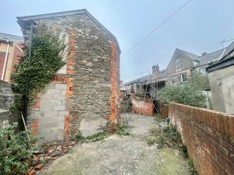 Extensive three-storey Investment/Development property in prominent corner position including detached coach house to the rear. Potential for further development, subject to any necessary consents.