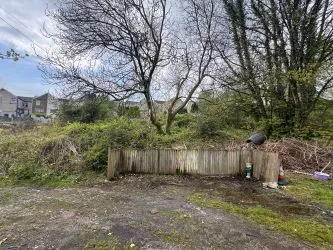Opportunity to acquire this freehold mixed use building with ground floor commercial unit and first floor rooms. Rear parking and development land in Maesteg.