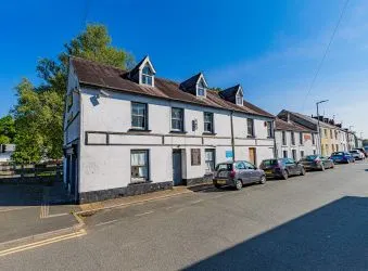 Extensive semi-detached former pub and most recently gift shop and gallery (Fabio) which has been partly re-developed to offer four apartments to the upper floors (two completed) with further potential to the lower floors for commercial or residential use, (subject to consents).
