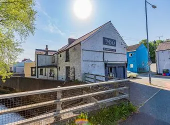 Extensive semi-detached former pub and most recently gift shop and gallery (Fabio) which has been partly re-developed to offer four apartments to the upper floors (two completed) with further potential to the lower floors for commercial or residential use, (subject to consents).