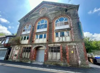 Substantial three storey building on the edge of Tonypandy town centre. Full planning permission awarded for the conversion to 18 residential units and 5 commercial units. Planning ref - 15/1055/FUL