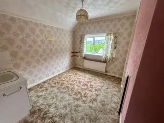 A substantial, four bedroom home in a generous plot with a driveway and double garage. Located on the edge of this popular village close to Abergavenny. In need of repair and improvement throughout.