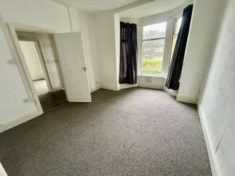 Larger than usual double bay-fronted one bedroom ground floor apartment with its own entrance in this popular area of Barry. In reasonable order but in need of decorative improvement throughout