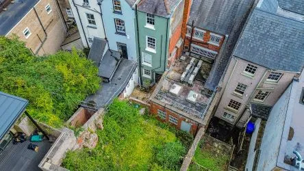 Attractive Grade II listed former bank in this prominent position in the centre of Monmouth with accommodation over three floors including the basement.
