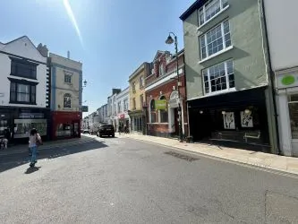 Attractive Grade II listed former bank in this prominent position in the centre of Monmouth with accommodation over three floors including the basement.