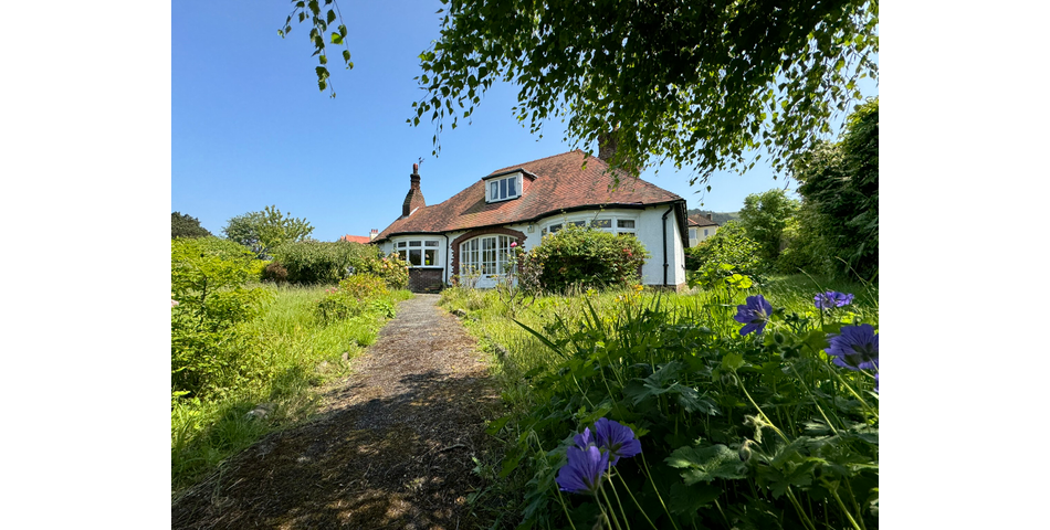 Charming Bungalow on Corner Plot Awaits Transformation