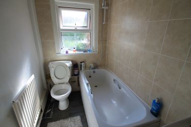 A Mid-Terraced Property, Conveniently Located In A Village Centre, Currently Split Into Two Bedsits And Let Producing A Gross Annual Income Of £9600
