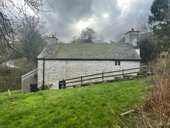A three bedroom character cottage in a charming rural location on the outskirts of Llanrhaeadr Ym Mochnant with views over the surrounding countryside and offering scope for improvement.