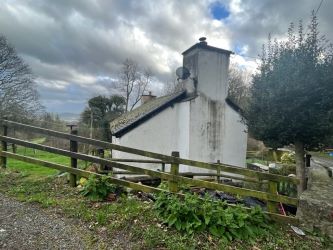 A three bedroom character cottage in a charming rural location on the outskirts of Llanrhaeadr Ym Mochnant with views over the surrounding countryside and offering scope for improvement.