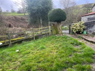 A three bedroom character cottage in a charming rural location on the outskirts of Llanrhaeadr Ym Mochnant with views over the surrounding countryside and offering scope for improvement.