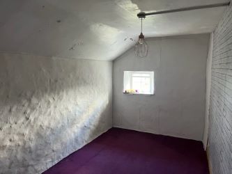 A three bedroom character cottage in a charming rural location on the outskirts of Llanrhaeadr Ym Mochnant with views over the surrounding countryside and offering scope for improvement.