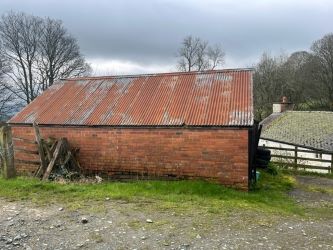 A three bedroom character cottage in a charming rural location on the outskirts of Llanrhaeadr Ym Mochnant with views over the surrounding countryside and offering scope for improvement.